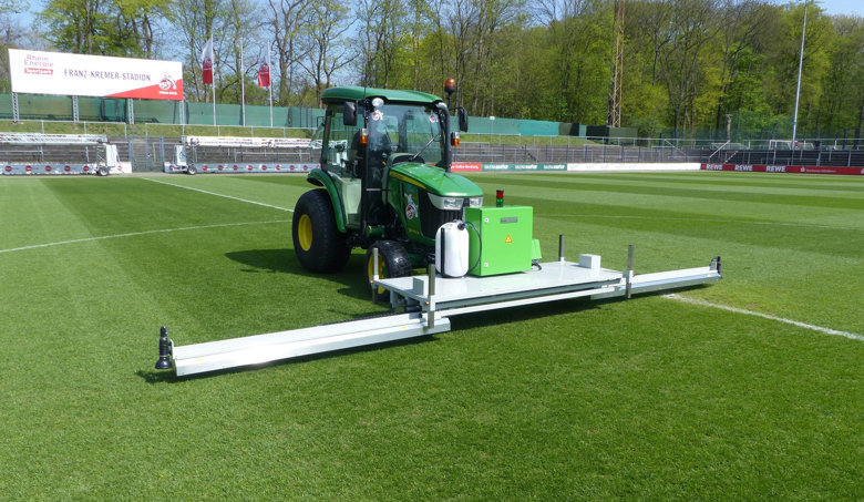 Mobile RHENAC UVC 600 lawn disinfector in use on sports surfaces